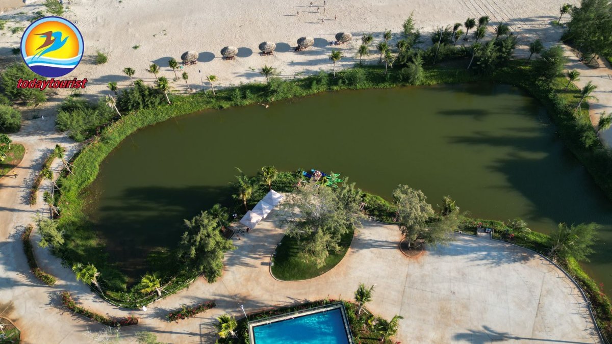 Stunning aerial shot of Hồ Tràm beach, lagoon, and resort pool in Viet