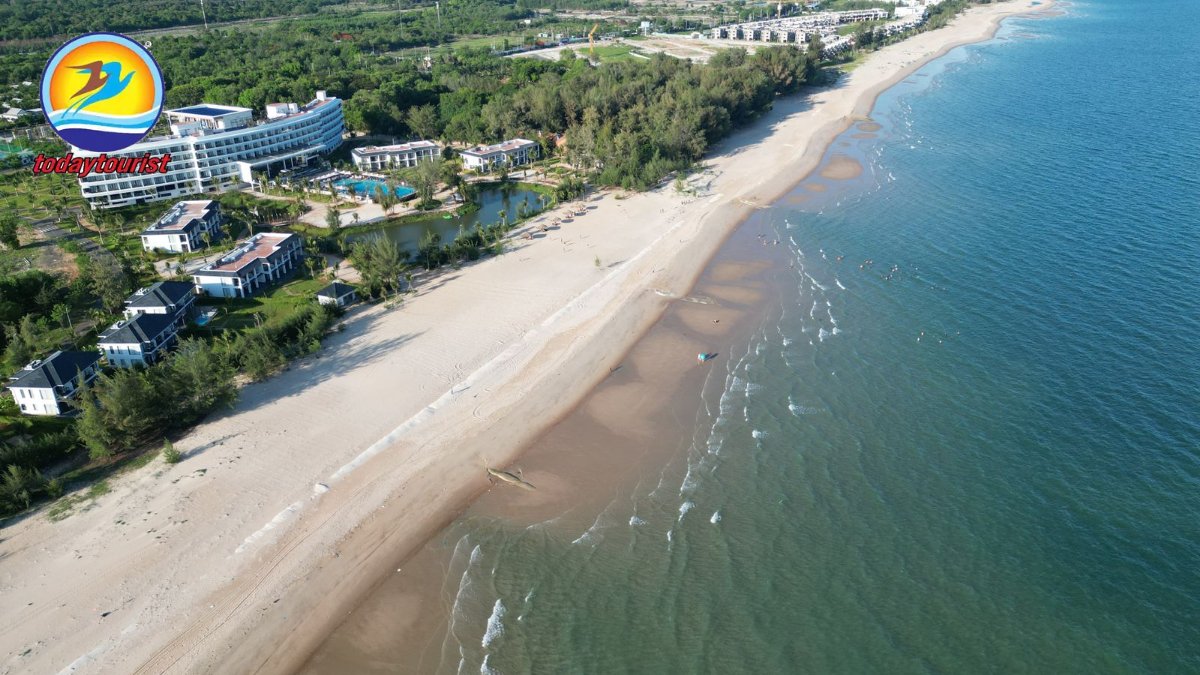Stunning aerial view of a luxury beach resort along Hồ Tràm coastline,