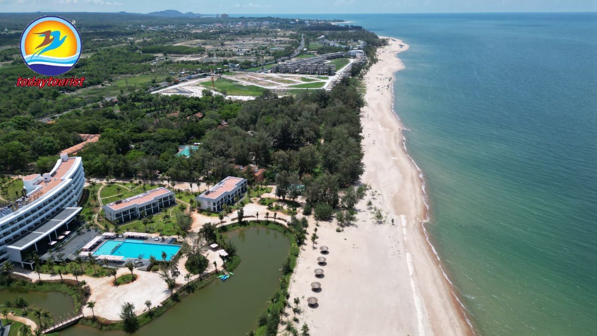 Stunning aerial view of Hồ Tràm beach with luxury resorts and lush gre