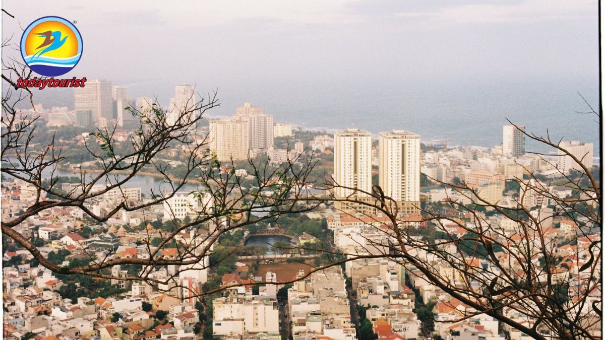A stunning aerial view of a coastal cityscape with skyscrapers and the