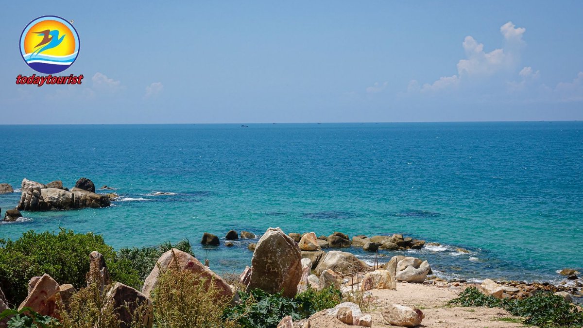 Picturesque scenery of coast with rocks near serene blue sea on sunny 