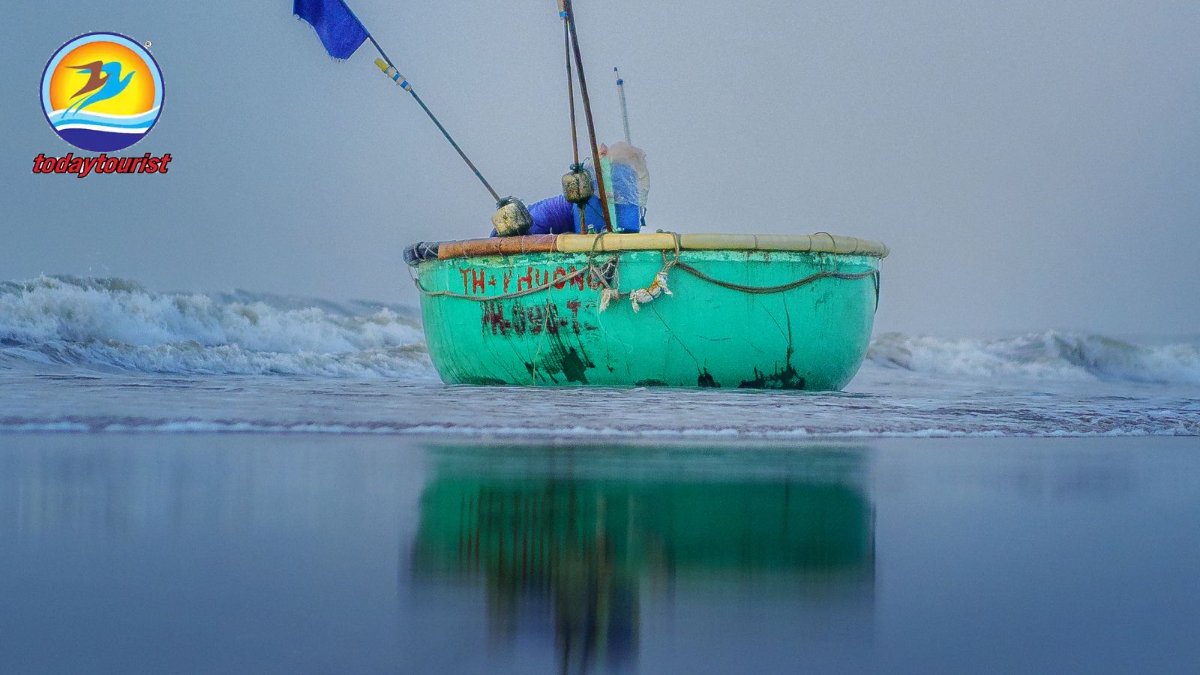 Tranquil image of a fishing boat on Phước Hải Beach, Vietnam at dusk, 
