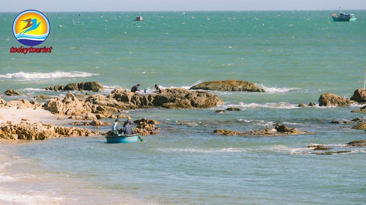 A tranquil seascape with a small fishing boat near a rocky coastline o