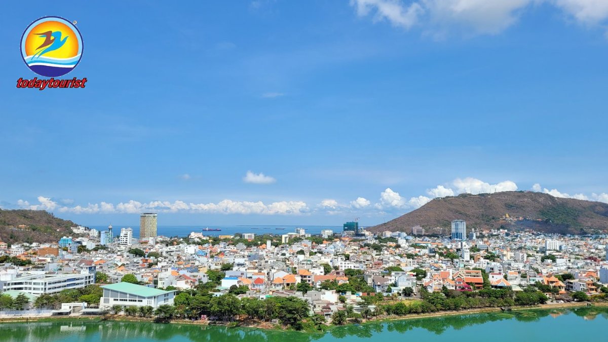 A stunning aerial view of Vung Tau's coastal cityscape under a clear b