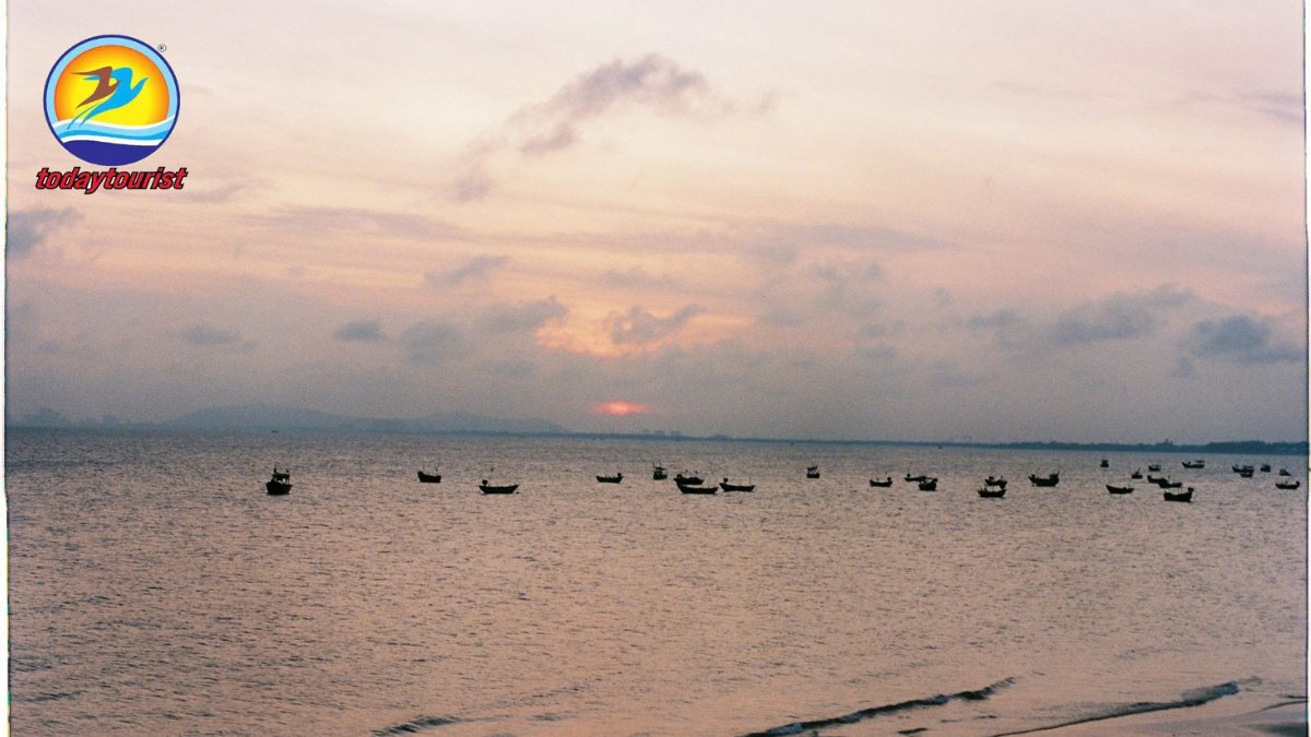 Tranquil seascape with boats at sunset in Vũng Tàu, Vietnam.