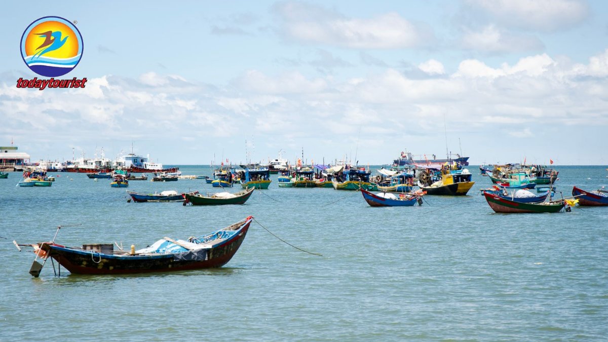 Colorful fishing boats float peacefully on a sunny day at sea, perfect