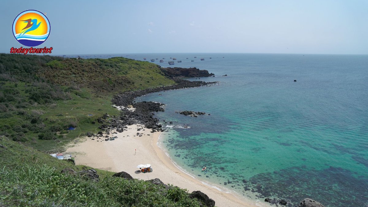 Aerial view of a serene beach and turquoise ocean in Phan Thiết, Vietn