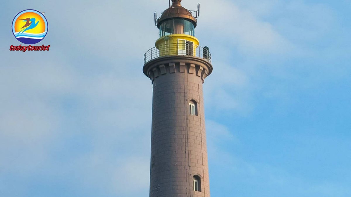 Elevated view of a historic lighthouse amidst lush greenery in Phu Yen